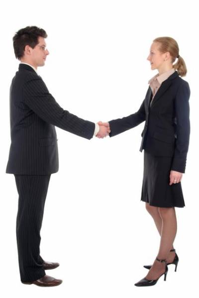 Businesswoman And Businessman Shaking Hands