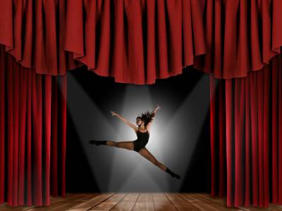 Dancer girl in curtain