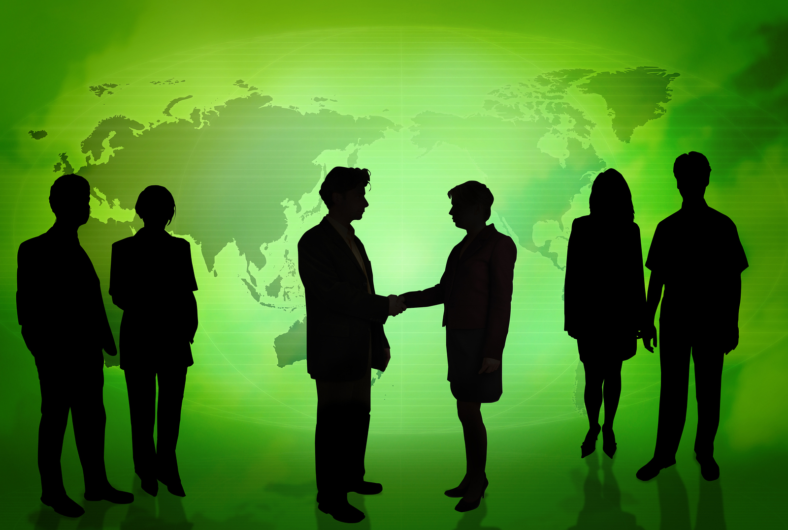 Business People In Front Of A Green Map Background
