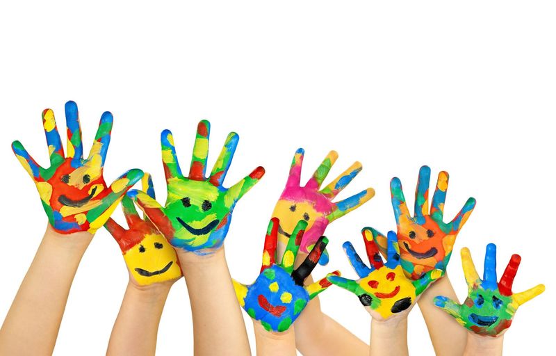 Many painted colorful childrens hands free powerpoint background